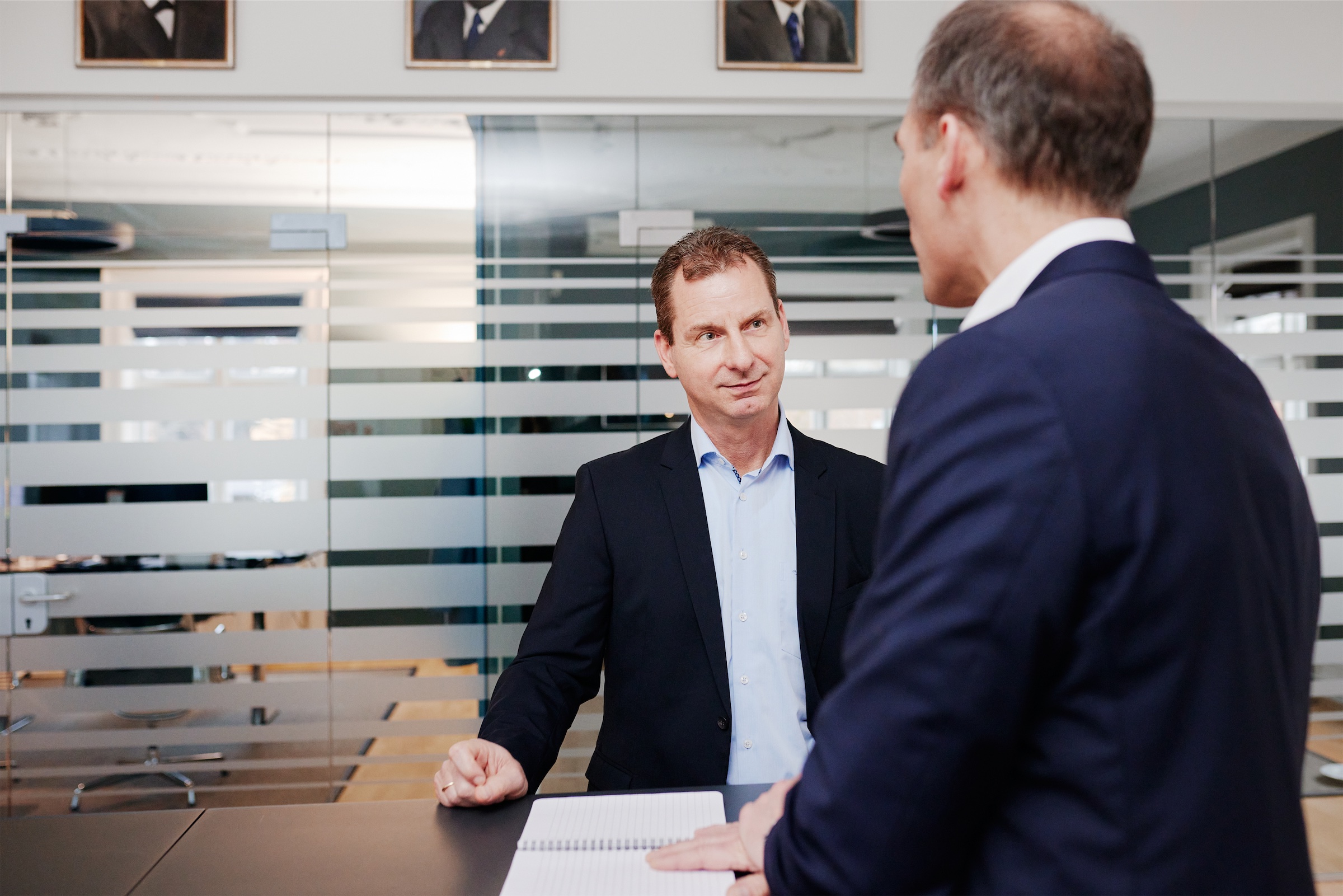 Dirk Theissen is having a chat with his colleague Christopher Schrader at the Copenhagen office of Chr. Olesen